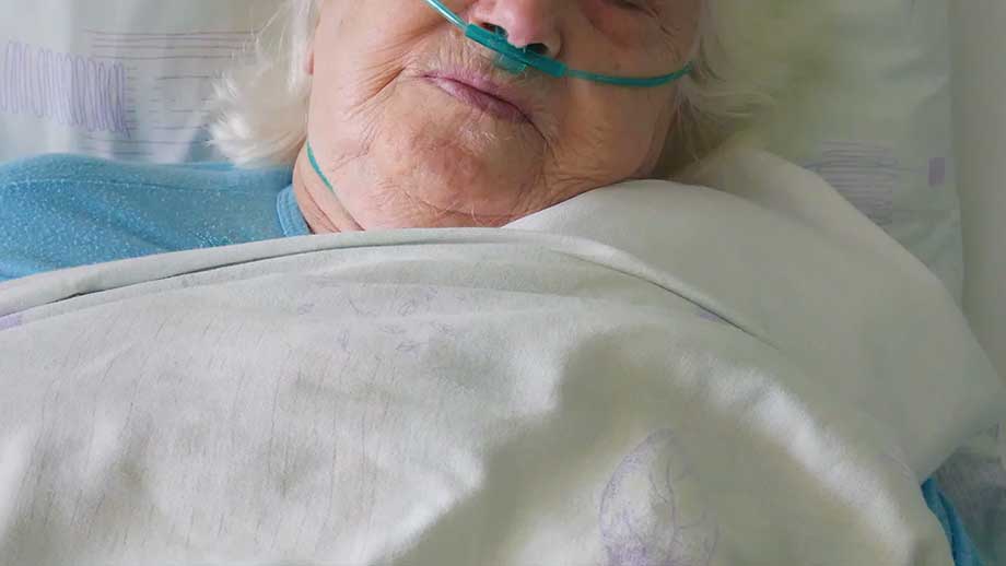 old-woman-in-hospital-bed